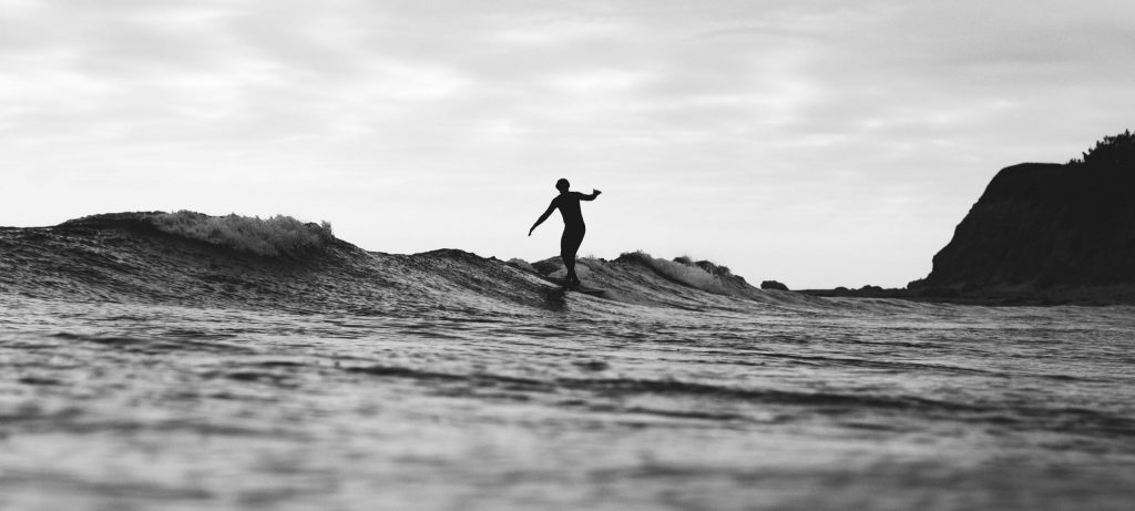 Surfer catches wave in Santa Barbara